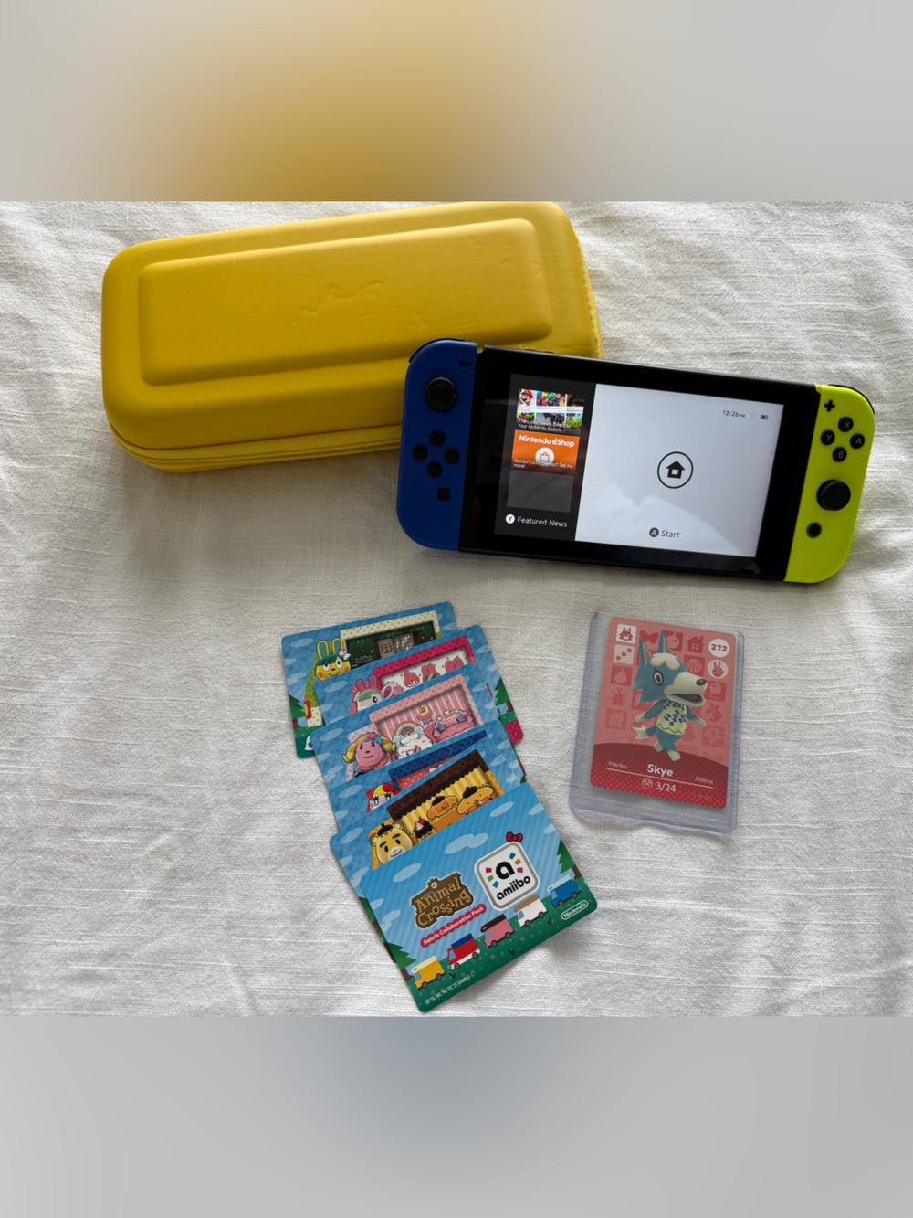 Nintendo Switch with Neon Blue & Neon Yellow Joy-Con and Yellow Carry Case